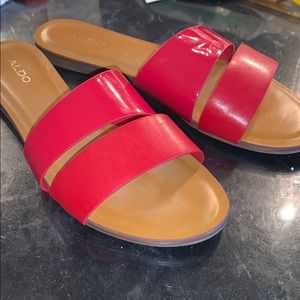 Red slide-on Aldo sandals